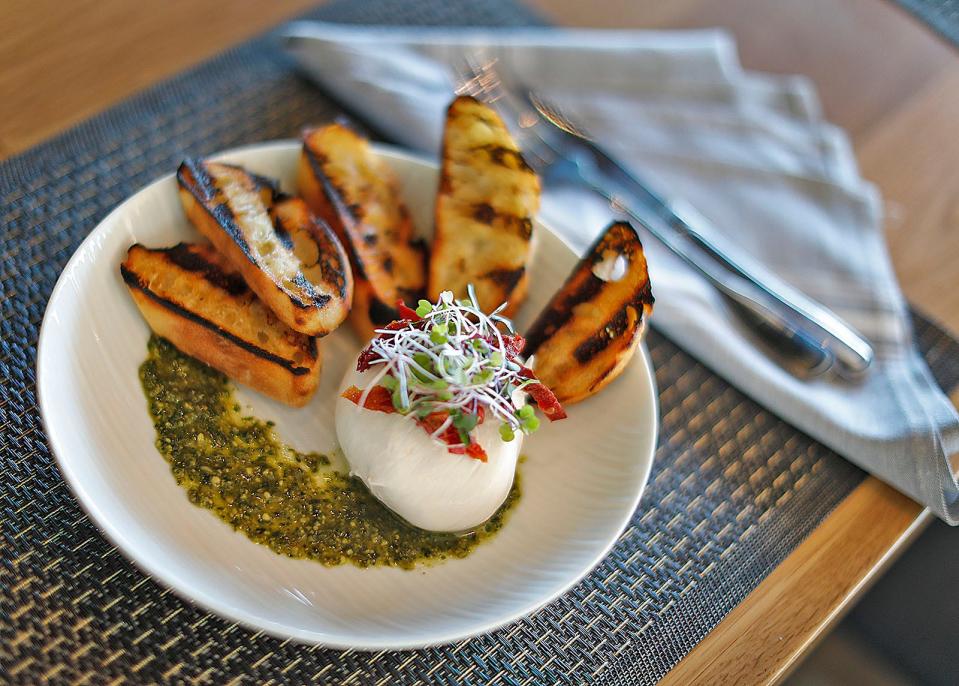 The Local Burrata with basil pesto and sundried tomatoes and crostini at The Beth at the Hingham Shipyard on Tuesday, July 19, 2022.