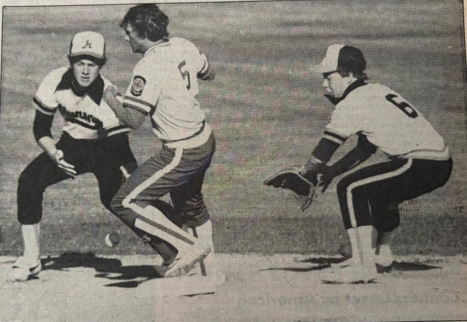 Watertown Post 17 base runner Jimmy Engels stands up after stealing second base during a 1985 American Legion Baseball doubleheader against Huron at Watertown Stadium. Huron shortstop Greg Schneider and second baseman Kyle Will were not able to stop the throw from going into center field.