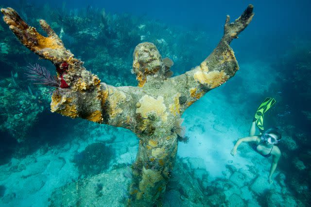 <p>Image Source/Getty </p> Christ of the Abyss Statue, John Pennekamp Park, Key Largo, Florida