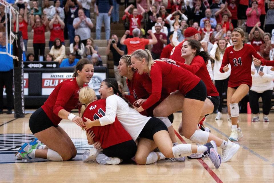 Paul Laurence Dunbar players celebrate after defeating Great Crossing 3-1 in high school volleyball’s 11th Region Tournament championship game at Paul Laurence Dunbar High School on Thursday. Jack Weaver