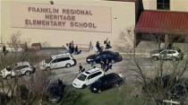 People are seen outside of Franklin Regional Heritage Elementary School after reports of stabbing injuries are reported at Franklin Regional High School in Murrysville, Pennsylvania April 9, 2014, in this still image taken from video courtesy of WPXI. REUTERS/WPXI/Handout via Reuters