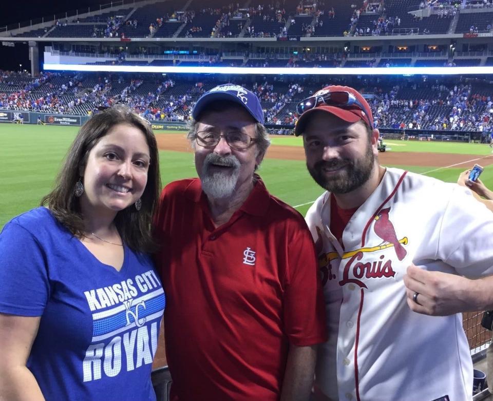 Steve Hoots with his son Adam and daughter Elizabeth at a baseball game.