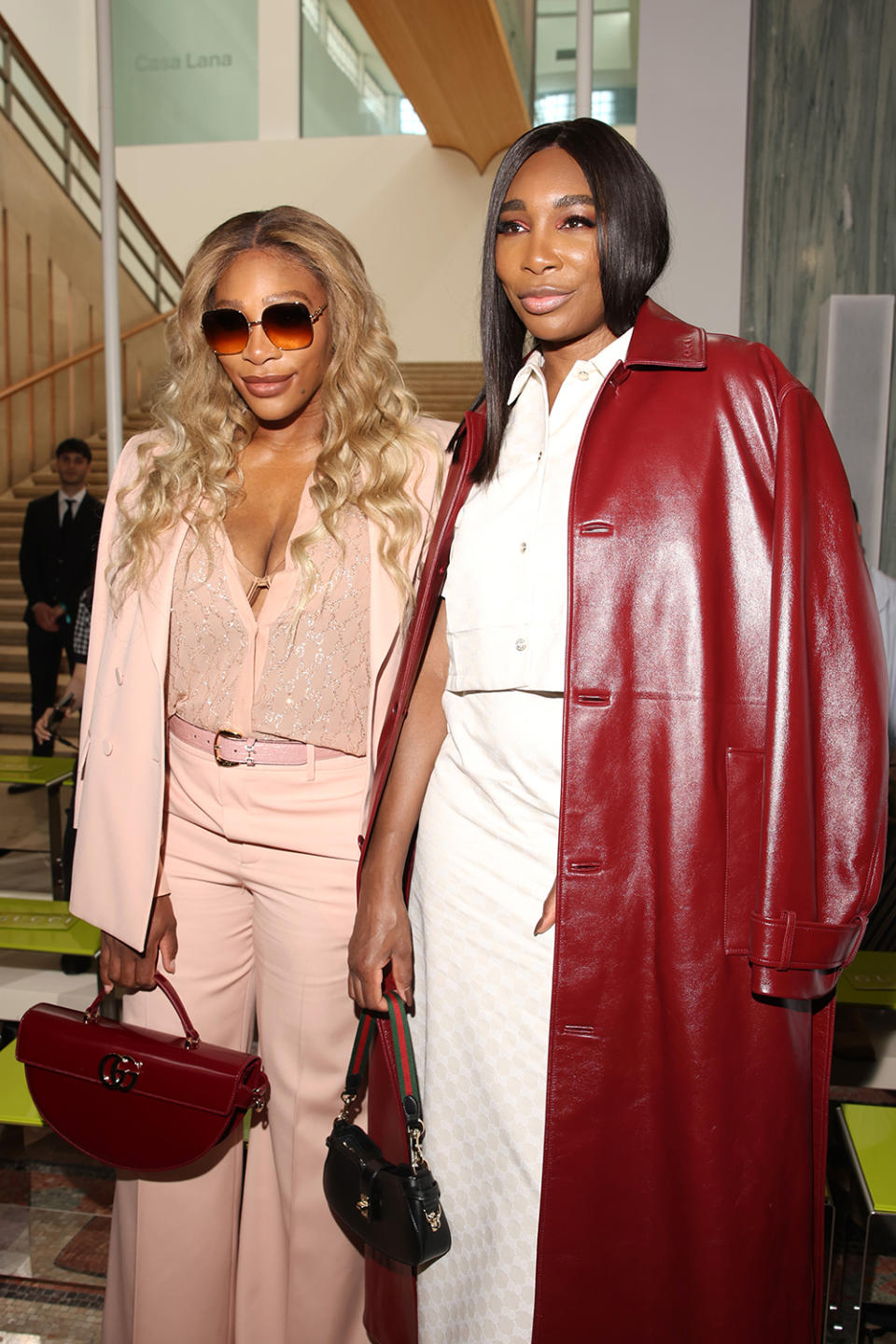 Venus Williams and Serena Williams attend the Gucci spring 2025 menswear fashion show on June 17 in Milan, front row, Ancora red, monogram