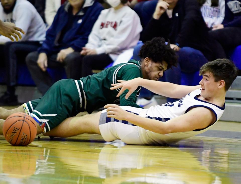 Chambersburg's Colton Cornwell and Jayden Smith of Carlisle battle for a loose ball. Chambersburg battled Carlisle but took a 44-37 loss Tuesday, January 23, 2024 at home.
