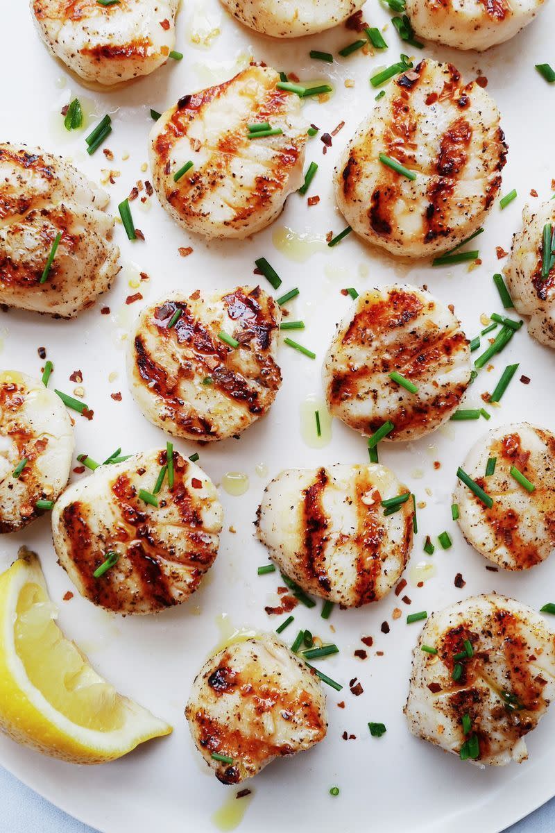<p>Scallops will make you feel fancy no matter what—and they're so easy to grill. When seasoned with some salt, pepper, and chilli flakes, they're pure gold. Oh, and did we mention they take 5 minutes? </p><p>Get the <a href="https://www.delish.com/uk/cooking/recipes/a32821279/best-grilled-scallops-recipe/" rel="nofollow noopener" target="_blank" data-ylk="slk:Grilled Scallops;elm:context_link;itc:0" class="link ">Grilled Scallops</a> recipe.</p>