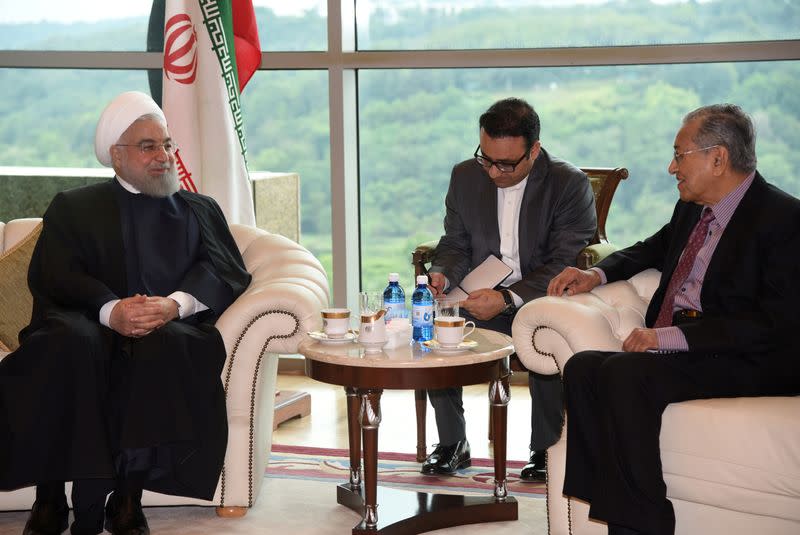 Malaysia's Prime Minister Mahathir Mohamad meets with Iranian President Hassan Rouhani at Prime Minister Office in Putrajaya