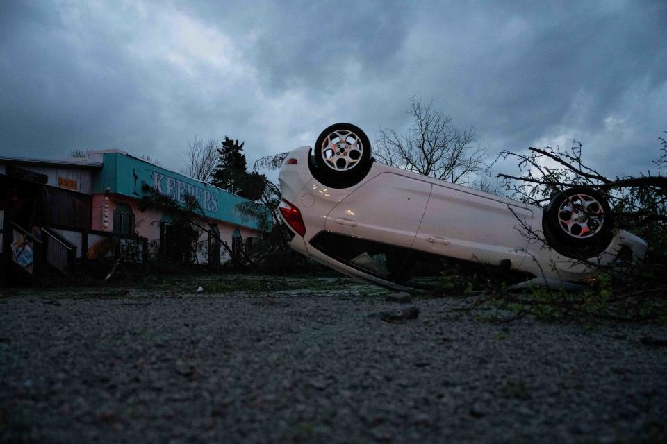 Damage from a tornado that came through Smithfield, Ky that turned over a car and caused a tree to fall on Keeper’s Seafood Restaurant on Tuesday, April 2, 2024.