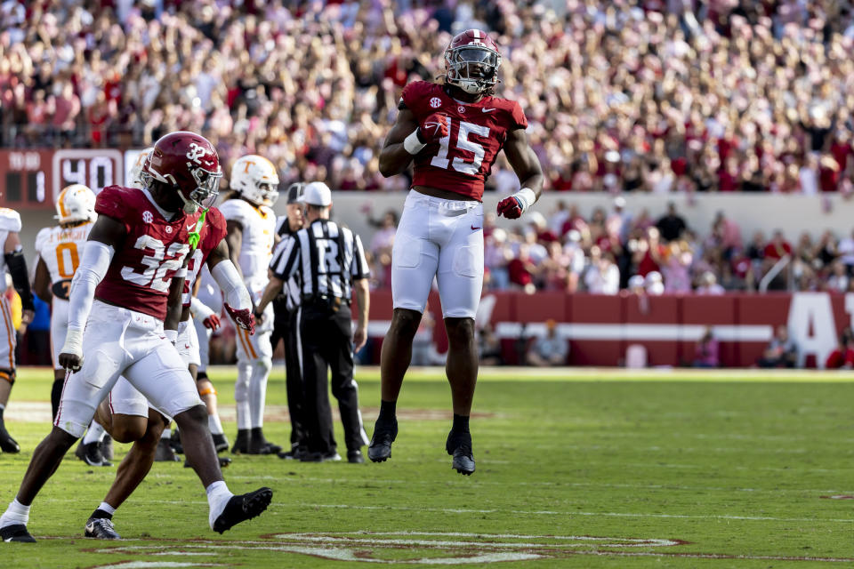 Alabama linebacker Dallas Turner (15) celebrates a fourth-down stop against Tennessee during the first half of an NCAA college football game, Saturday, Oct. 21, 2023, in Tuscaloosa, Ala. Alabama linebacker Deontae Lawson (32) is also pictured. (AP Photo/Vasha Hunt)