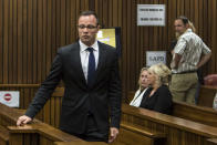 Oscar Pistorius, arrives at the court with June Steenkamp, back left, mother of the late Reeva Steenkamp, Monday, March 17, 2014. Pistorius is on trial for the murder of his girlfriend Reeva on Valentines Day 2013. (AP Photo/Daniel Born, Pool)