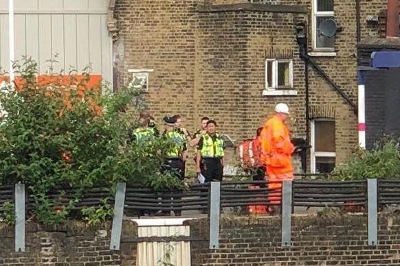 Police and Network Rail engineers at the scene in Loughborough Junction, near Brixton, where the bodies of three people were found on the tracks (Barney Davis)