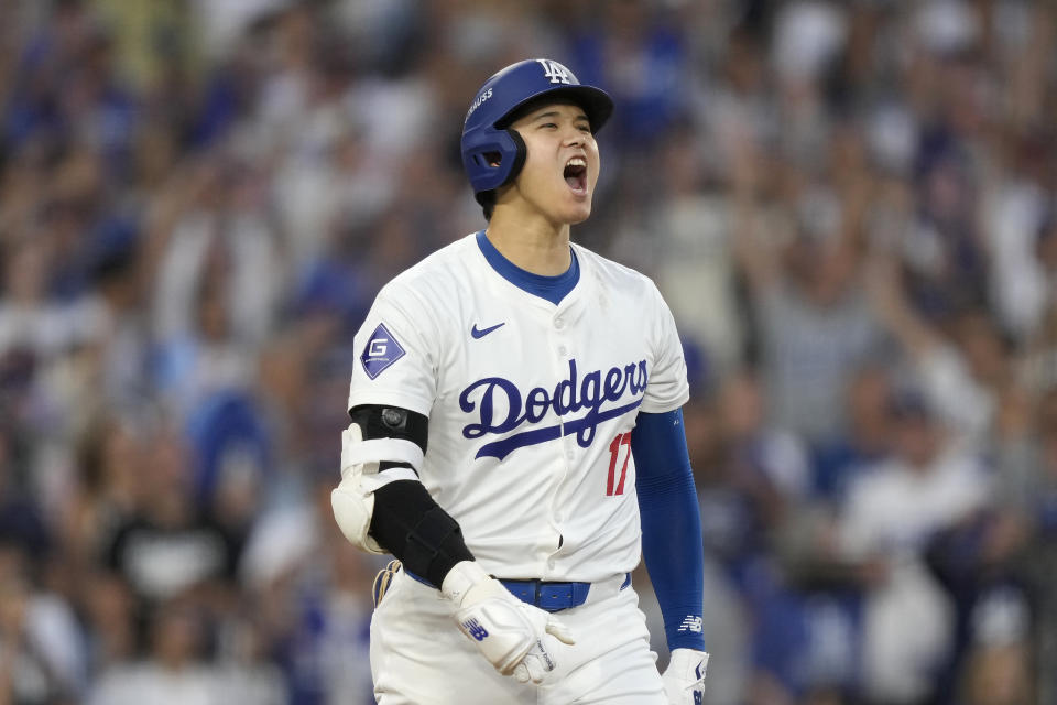 Los Angeles Dodgers' Shohei Ohtani reacts after hitting a three-run home run during the second inning in Game 1 of baseball's NL Division Series against the San Diego Padres, Saturday, Oct. 5, 2024, in Los Angeles. (AP Photo/Mark J. Terrill)