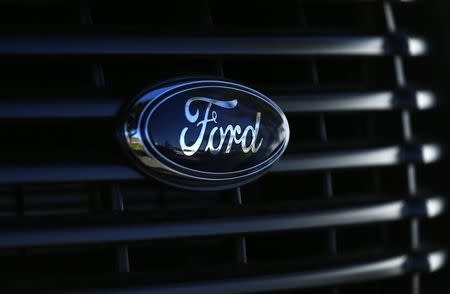 The front grill logo of a Ford F150 pick-up truck is shown in Carlsbad, California November 5, 2014. REUTERS/Mike Blake