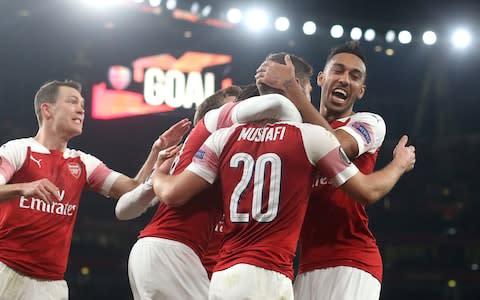 Pierre-Emerick Aubameyang of Arsenal congratulates Shkodran Mustafi of Arsenal as he celebrates scoring their 2nd goal during the UEFA Europa League Round of 32 Second Leg match between Arsenal and BATE Borisov at England on February 21, 2019 in London, United Kingdom. - Credit: Getty Images