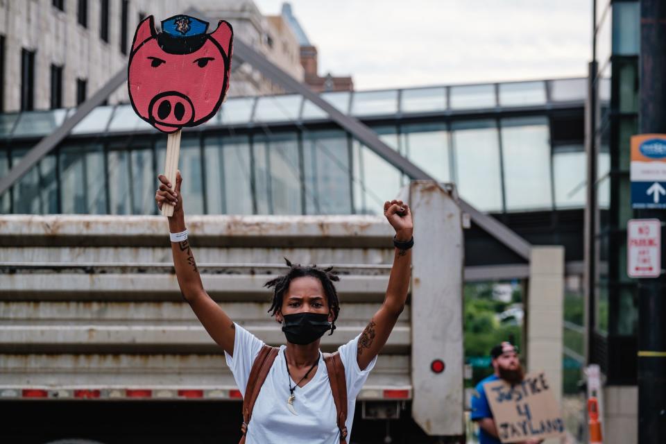 Akron resident Winter Carter, 23, protests at the Harold K. Stubbs Justice Center in response to the shooting death of Jayland Walker, Monday, July 4 in Akron.