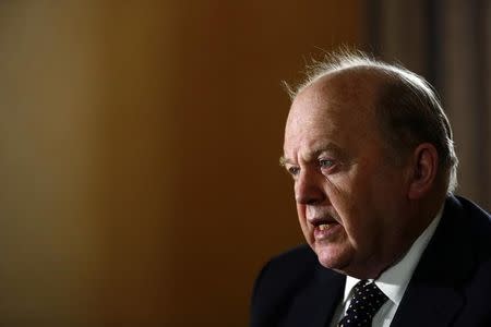 Ireland's Finance Minister Michael Noonan attends an interview with Reuters at his office in central Dublin February 11, 2014. REUTERS/Cathal McNaughton