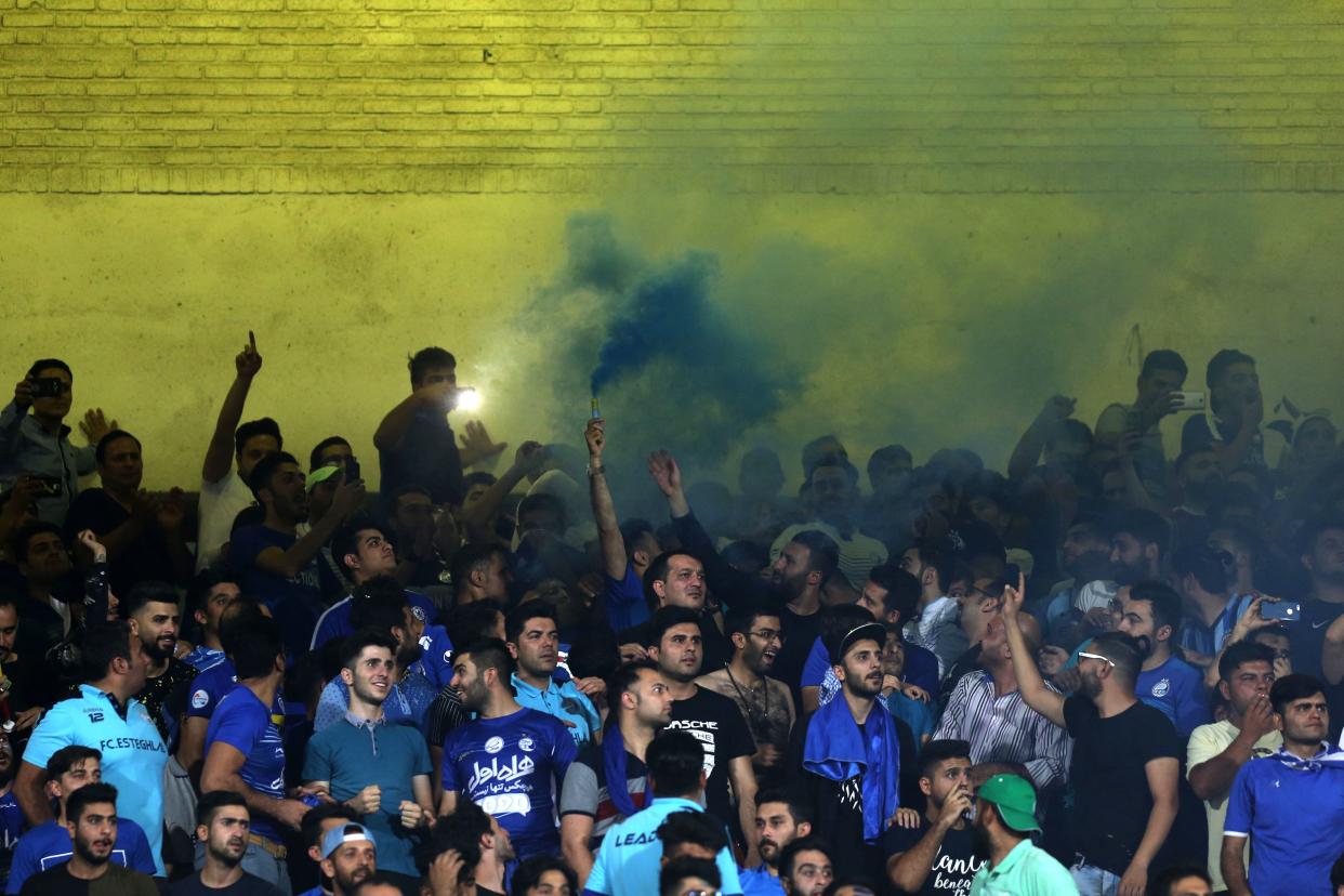 Iranian fans cheer for their team during the AFC Champions League football match Al-Sadd (Qatar) vs Esteghlal FC (Iran) at the Azadi stadium in Tehran on August 27, 2018. (Photo by ATTA KENARE / AFP)        (Photo credit should read ATTA KENARE/AFP/Getty Images)