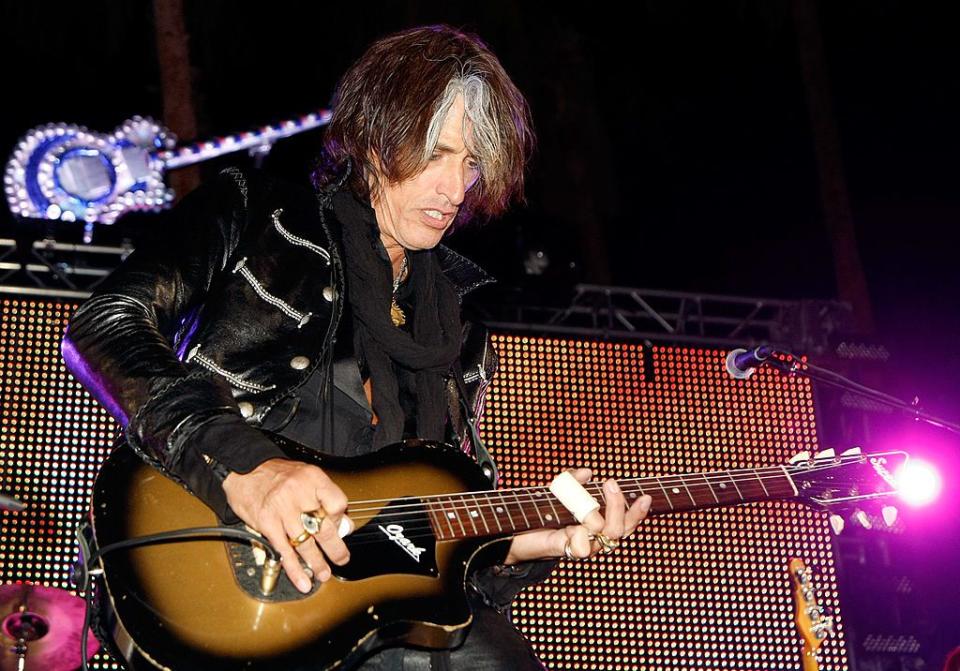 LAS VEGAS - OCTOBER 02:  Aerosmith guitarist Joe Perry performs during a concert at the Bare Pool Lounge at The Mirage Hotel & Casino to celebrate the resort's 20th anniversary October 2, 2009 in Las Vegas, Nevada.  (Photo by Ethan Miller/Getty Images)