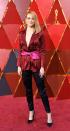 <p>Emma Stone ditched the dress and wears silk black pants paired with a maroon and prink silk jacket. Her hair and make up was a fan favourite.</p>