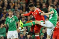 Republic of Ireland's defender John O'Shea (R) vies with Wales's striker Hal Robson-Kanu during the World Cup 2018 qualification football match March 24, 2017