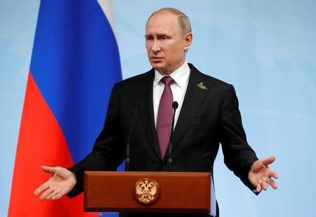 FILE PHOTO: Russian President Vladimir Putin speaks during a news conference after the G20 summit in Hamburg, northern Germany, July 8, 2017. REUTERS/Alexander Zemlianichenko/POOL/File Photo