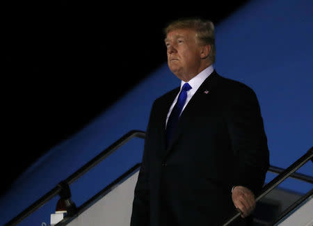 U.S. President Donald Trump disembarks Air Force One after arriving in Singapore June 10, 2018. REUTERS/Jonathan Ernst