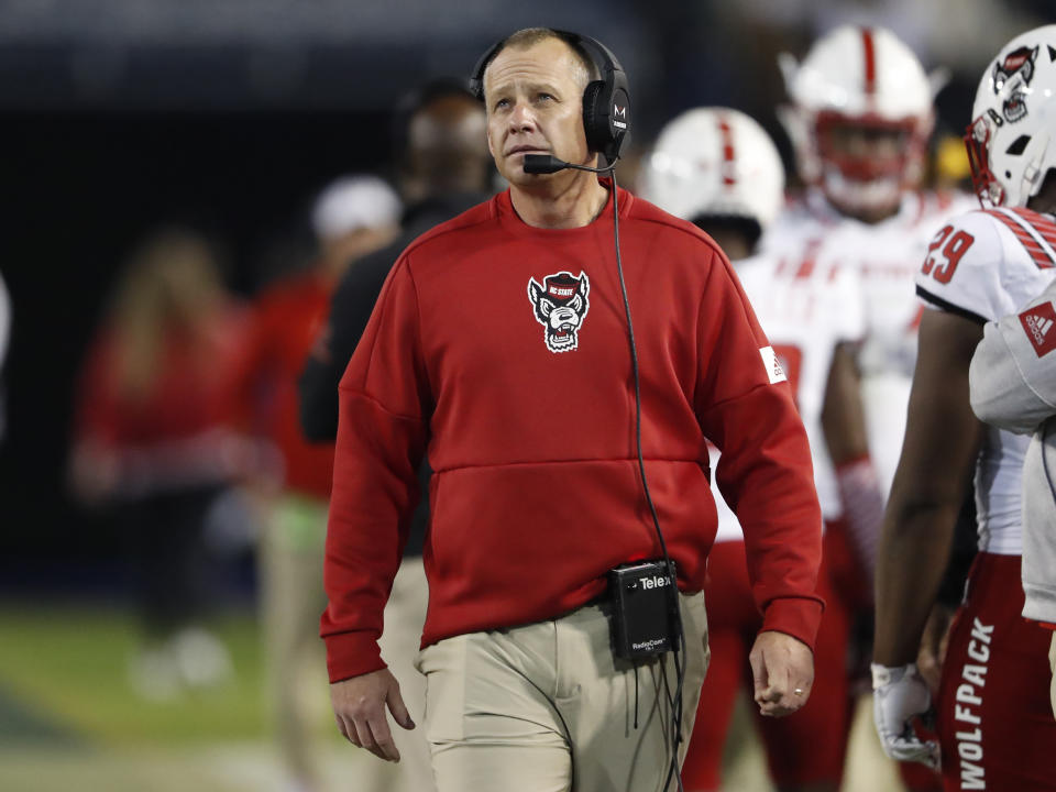 FILE - In this Nov. 21, 2019, file photo, North Carolina State coach Dave Doeren paces on the sideline during the second half of the team's NCAA college football game against Georgia Tech in Atlanta. The Wolfpack will try to regroup after winning just four games last season. (AP Photo/John Bazemore, File)