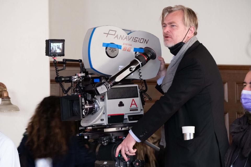 Writer, director, and producer Christopher Nolan on the set of OPPENHEIMER. (Universal)