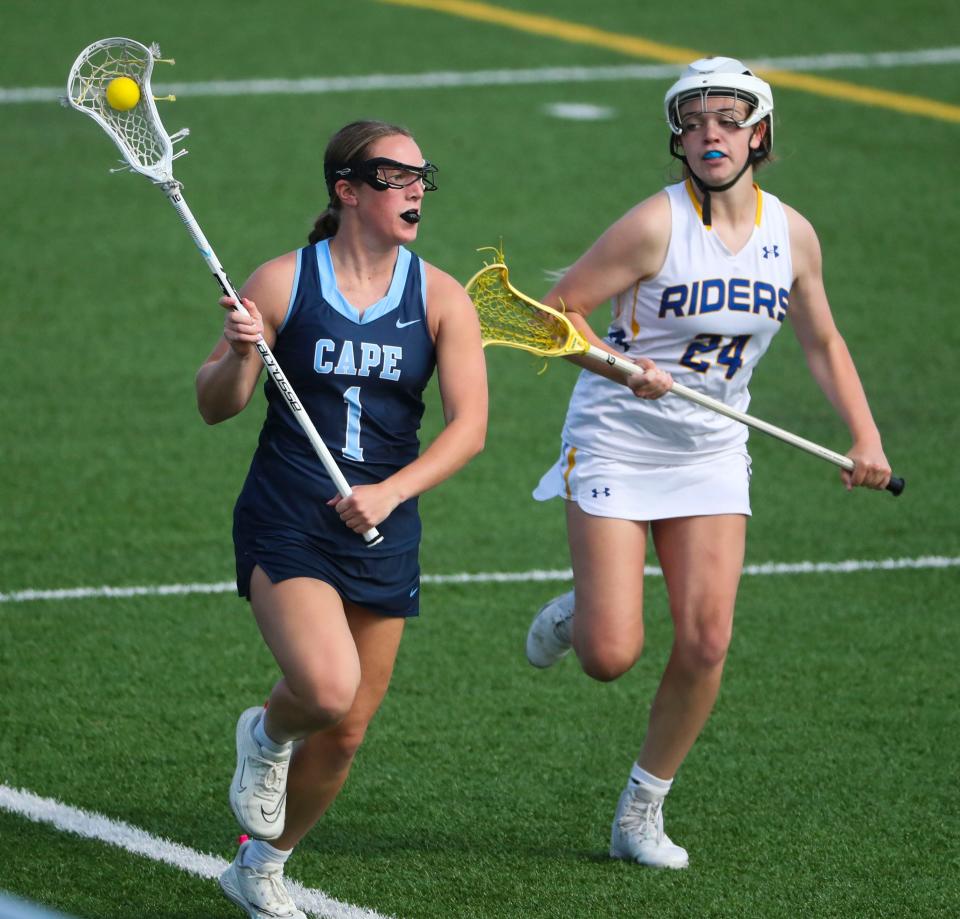 Cape Henlopen's Montana Jones (1) is pursued by Caesar Rodney's Alexis Riley in the second half of Cape Henlopen's 17-6 win at Caesar Rodney, Wednesday, April 26, 2023.