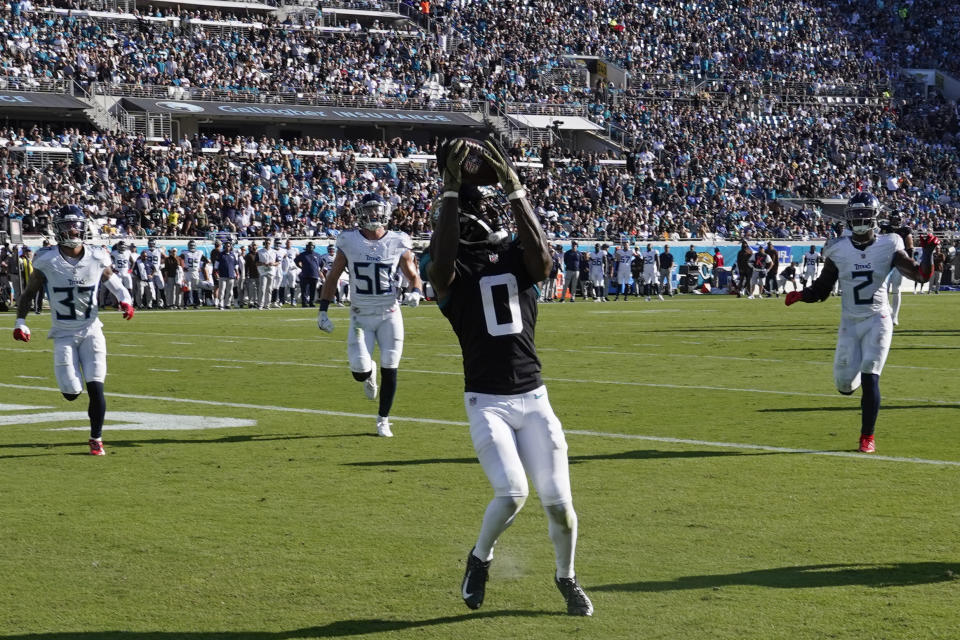 Jacksonville Jaguars wide receiver Calvin Ridley (0) makes a catch in the end zone for a touchdown against the Tennessee Titans during the second half of an NFL football game, Sunday, Nov. 19, 2023, in Jacksonville, Fla. (AP Photo/John Raoux)