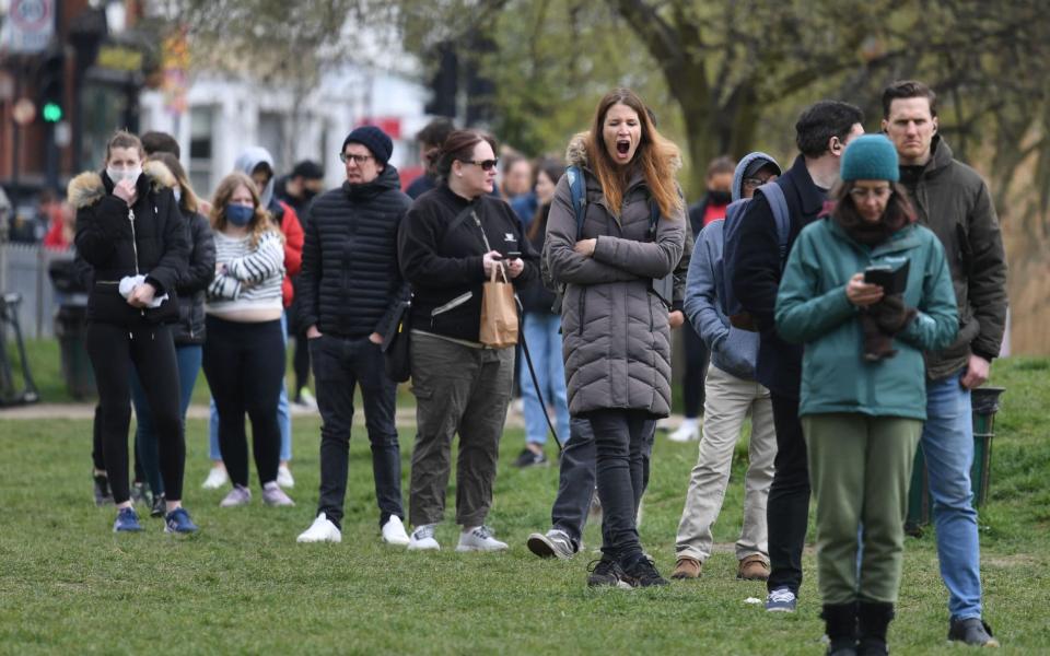 People queue to take a Covid-19 test at a mobile testing centre on Clapham Common. Residents in South London have been urged to get a test after 44 cases of the South Africa variant were detected in two boroughs -  DANIEL LEAL-OLIVAS/AFP via Getty Images