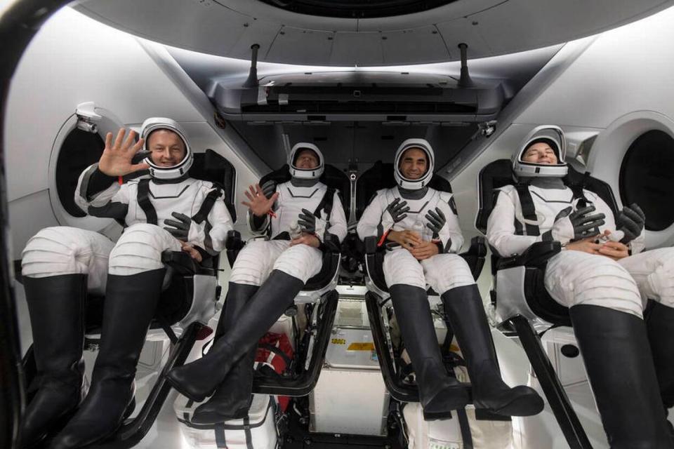 Astronaut Kayla Barron, right, is seen inside the SpaceX Crew Dragon Endurance spacecraft after it was pulled aboard a recovery ship shortly after landing in the Gulf of Mexico early Friday morning.