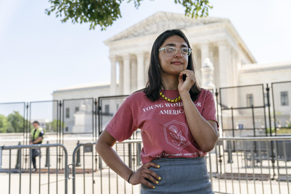 Alexandra McPhee, 29, of Arlington, Va., poses for a portrait while protesting outside the Supreme Court about abortion with the advocacy group, Concerned Women for America, where she is the director of government relations, Wednesday, June 15, 2022, in Washington. The 29-year old came to the court to protest in favor of Roe V. Wade's overturning along with the anti-abortion advocacy group Concerned Women for America. "I want to be out here to show that this is an issue that I care about that I believe is helpful for all women, all families, to have more protections for life than there are now. And this decision will make that possible." (AP Photo/Jacquelyn Martin)
