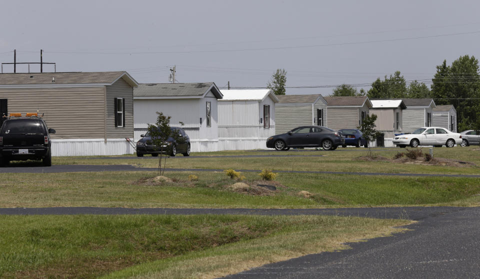 This photo taken Wednesday, May 29, 2019 shows homes at the Alamac Time Out community in Lumberton, N.C. Over the past two years, Time Out Communities has bought 21 properties in the Robeson County, a low income-county that was one of the hardest-hit in hurricanes Matthew and Florence. Mobile home residents in Robeson County, North Carolina are seeing increasing rent prices after being slammed by hurricanes Matthew and Florence.(AP Photo/Gerry Broome)