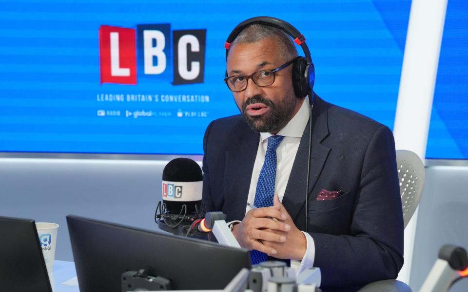 James Cleverly, the Home Secretary, takes part in an immigration debate on LBC this morning