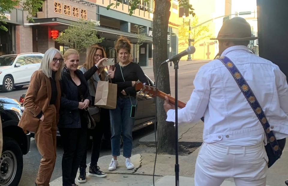 The Buffalo Kings' Trevor Darden plays a song for film star Diane Keaton and her friends on April 18 at Sparky's Bardega in downtown Asheville.
