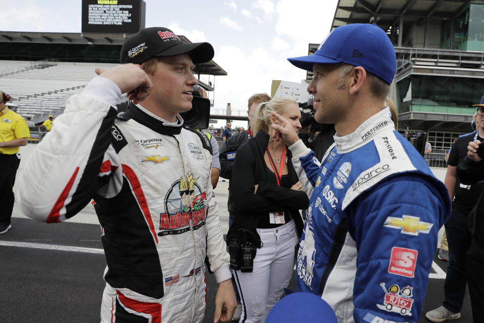 Spencer Pigot, left, talks with Ed Carpenter after qualifications for the Indianapolis 500 IndyCar auto race at Indianapolis Motor Speedway, Sunday, May 19, 2019 in Indianapolis. (AP Photo/Darron Cummings)