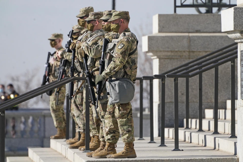 Utah National Guardsmen are shown at the Utah State Capitol Sunday, Jan. 17, 2021, in Salt Lake City. The FBI has warned of the potential for armed protests at the nation's Capitol and all 50 state capitol buildings beginning this weekend. (AP Photo/Rick Bowmer)