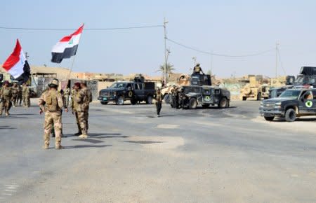 FILE PHOTO: Iraqi forces are seen after they captured Rawa town, the last remaining town under Islamic State control, Iraq November 17, 2017. REUTERS/Stringer