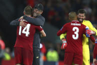 Liverpool's coach Juergen Klopp hugs Liverpool's Jordan Henderson after the Champions League Group C soccer match between Liverpool and Paris-Saint-Germain at Anfield stadium in Liverpool, England, Tuesday, Sept. 18, 2018. Liverpool won the match 3-2. (AP Photo/Dave Thompson)