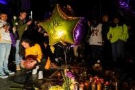 Mourners gather in Microsoft Square near the Staples Center to pay respects to Kobe Bryant after a helicopter crash killed the retired basketball star, in Los Angeles