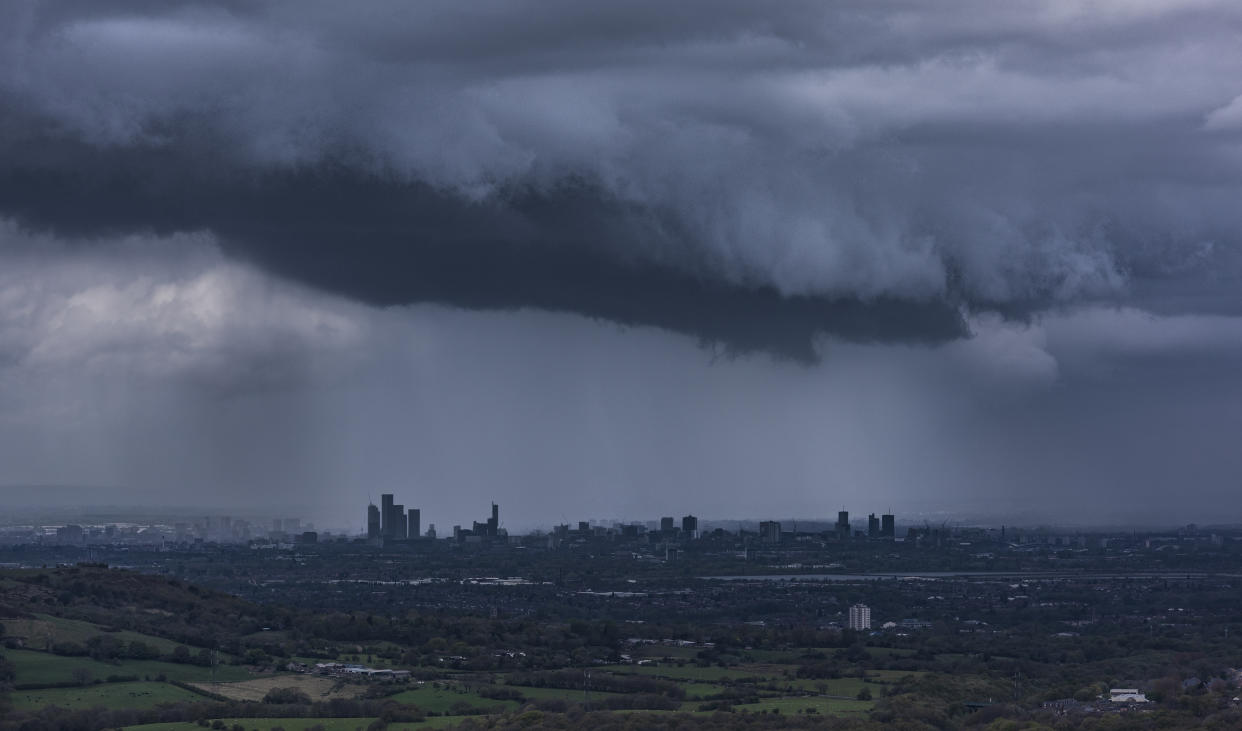 City of Manchester skyline under a stormy sky. Greater Manchester, North West England. UK.