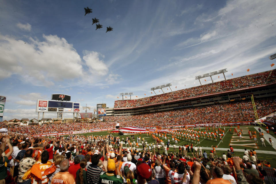 FILE - Tampa Bay Buccaneers fans cheer during a military fly over before an NFL football game against the Green Bay Packers in Tampa, in this Sunday, Nov. 8, 2009, file photo. Hall of Famer Warren Sapp wishes the Tampa Bay Buccaneers could pack the stands for the first Super Bowl played in a host team’s home stadium. (AP Photo/Brian Blanco, File)