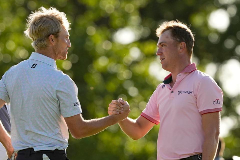 Justin Thomas is greeted by Will Zalatoris after winning their play-off for the US PGA Championship (Matt York/AP) (AP)