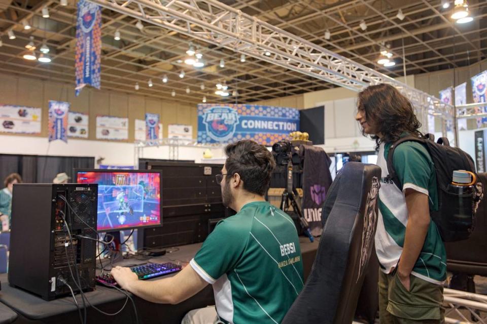 Sacramento State esports player Hamva Damnlakhi, a member of the green team, plays Overwatch while he warms up before the Bear Cup tournament at the California State Fair on Thursday. Kevin Neri/kneri@sacbee.com