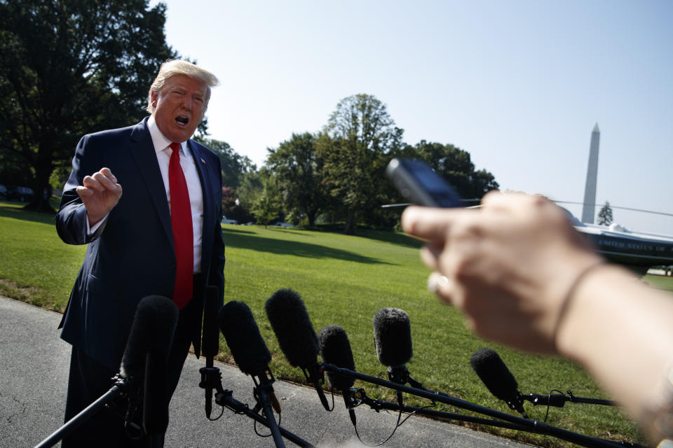 President Donald Trump talks with reporters before departing for an event to celebrate the 400th anniversary celebration of the first representative assembly at Jamestown, on the South Lawn of the White House, Tuesday, July 30, 2019, in Washington. (AP Photo/Evan Vucci)