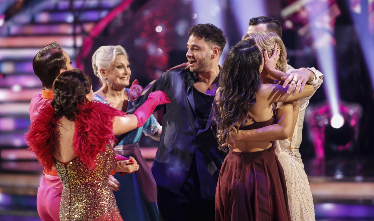 The other Strictly contestants rushed to console Adam Thomas after he was eliminated from the 2023 dancing competition. (BBC)
