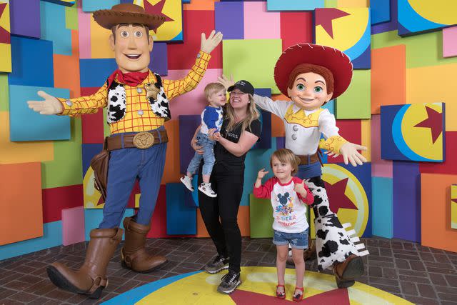 <p>Christian Thompson/Disneyland Resort via Getty</p> Kelly Clarkson with Remy and River