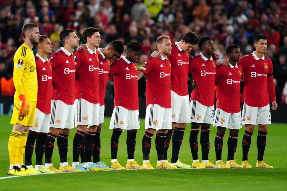 Manchester United players take part in a minute’s silence before their Europa League match against Real Sociedad (Martin Rickett/PA) (PA Wire)