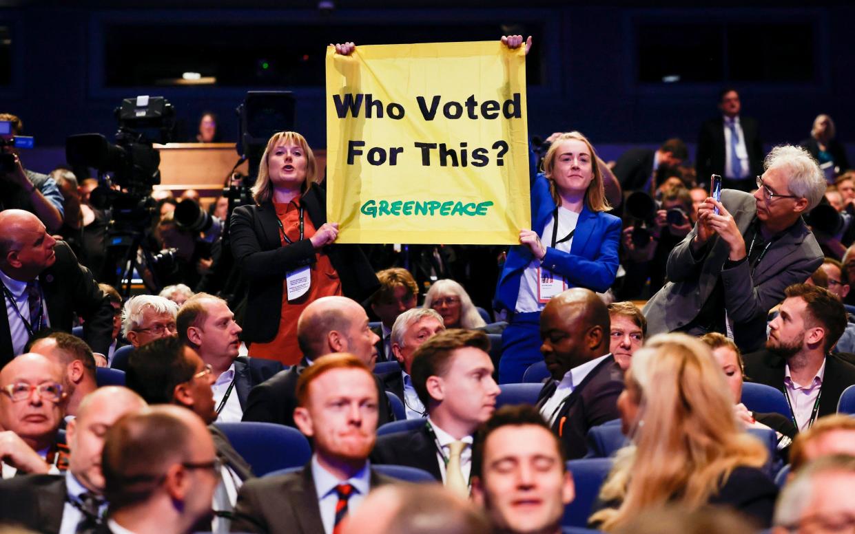 Rebecca Newsom and Ami McCarthy disrupt the Prime Minister's address to Tory members - Geoff Pugh for the Telegraph