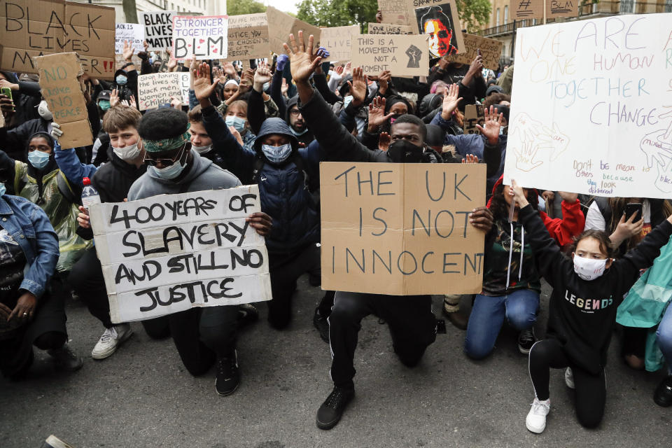 Demonstrators gather at Downing Street during a Black Lives Matter march in London, Saturday, June 6, 2020, as people protest against the killing of George Floyd by police officers in Minneapolis, USA. Floyd, a black man, died after he was restrained by Minneapolis police while in custody on May 25 in Minnesota. (AP Photo/Frank Augstein)